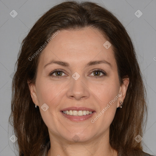 Joyful white adult female with medium  brown hair and brown eyes