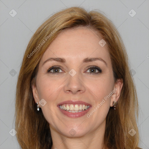 Joyful white adult female with medium  brown hair and brown eyes