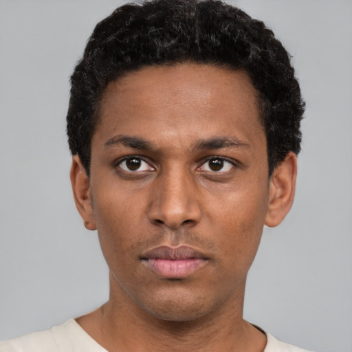 Neutral black young-adult male with short  black hair and brown eyes