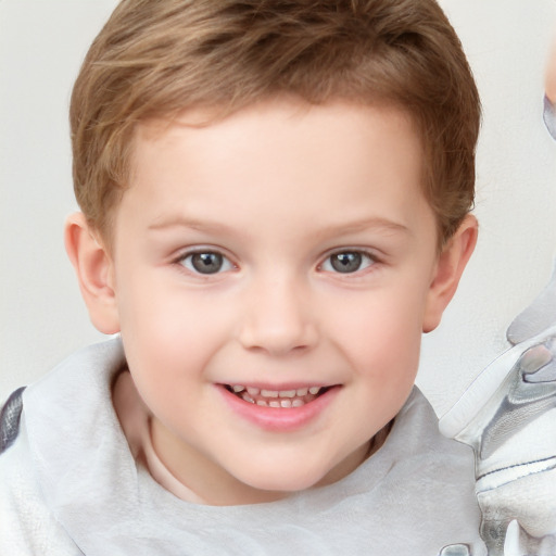 Joyful white child male with short  brown hair and brown eyes