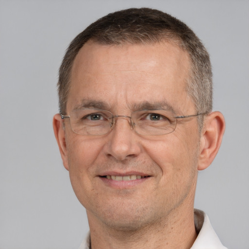 Joyful white middle-aged male with short  brown hair and brown eyes