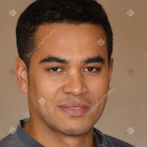 Joyful latino young-adult male with short  brown hair and brown eyes