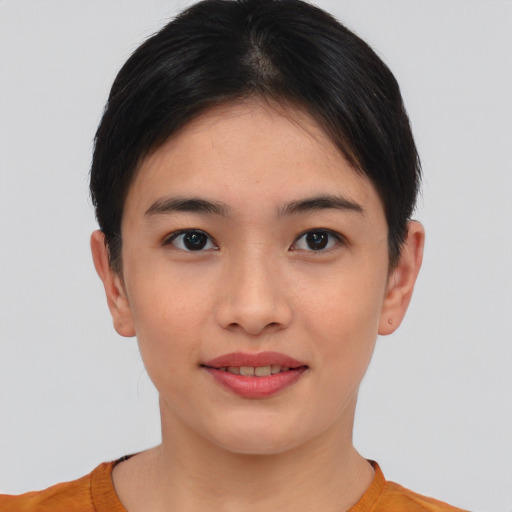Joyful asian young-adult female with short  brown hair and brown eyes