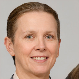 Joyful white adult female with short  brown hair and grey eyes