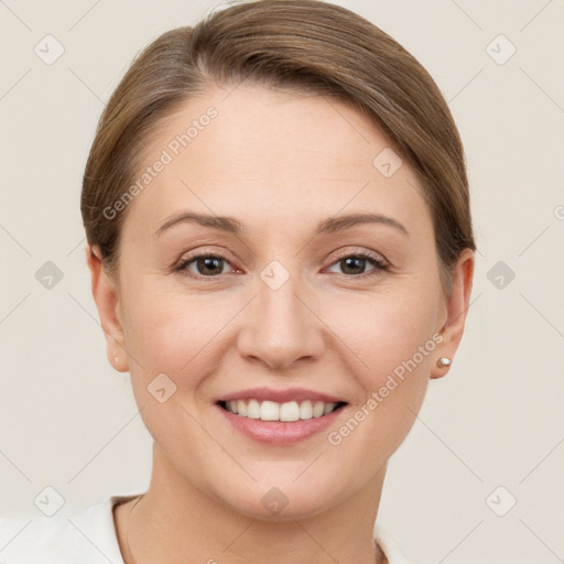 Joyful white young-adult female with short  brown hair and grey eyes