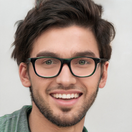 Joyful white young-adult male with short  brown hair and green eyes