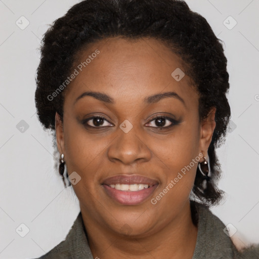 Joyful black adult female with medium  brown hair and brown eyes