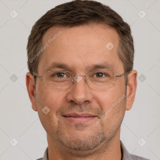 Joyful white adult male with short  brown hair and brown eyes