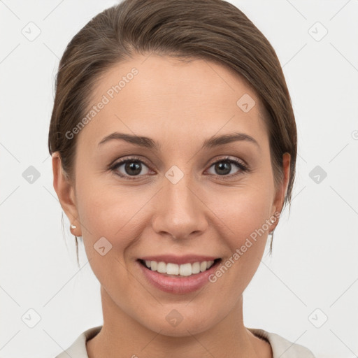 Joyful white young-adult female with medium  brown hair and grey eyes