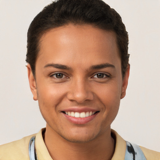 Joyful white young-adult female with short  brown hair and brown eyes