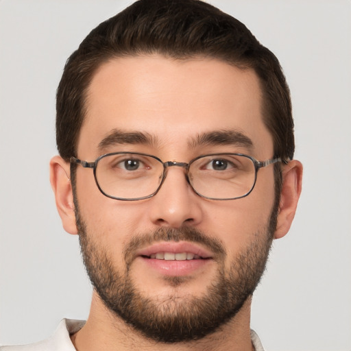 Joyful white young-adult male with short  brown hair and brown eyes