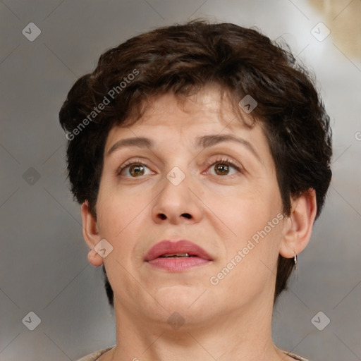 Joyful white adult female with short  brown hair and brown eyes