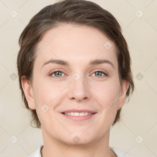 Joyful white young-adult female with medium  brown hair and grey eyes