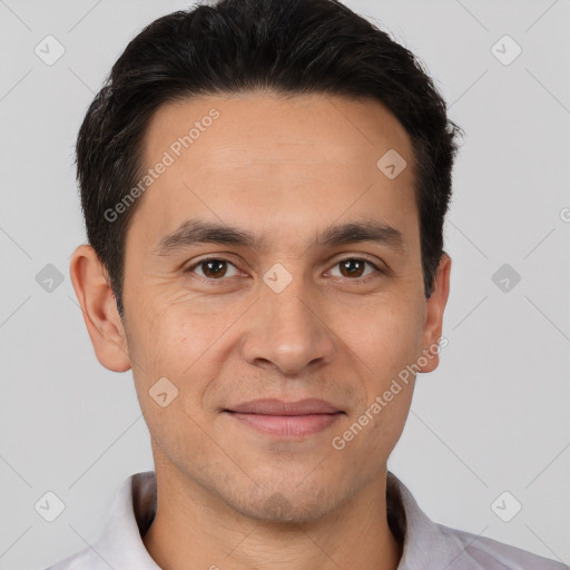 Joyful white young-adult male with short  black hair and brown eyes