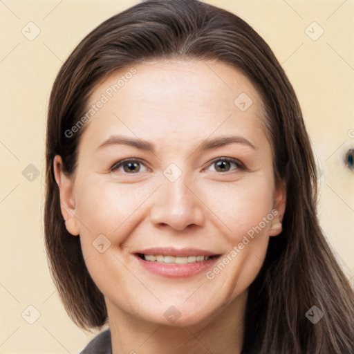 Joyful white young-adult female with long  brown hair and brown eyes