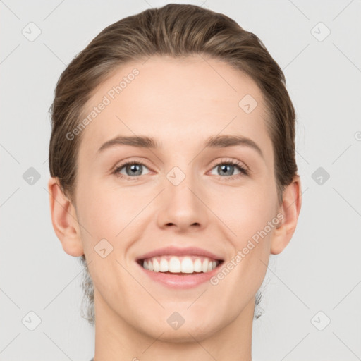 Joyful white young-adult female with short  brown hair and grey eyes