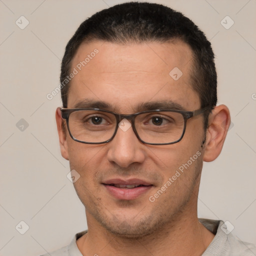 Joyful white adult male with short  brown hair and brown eyes