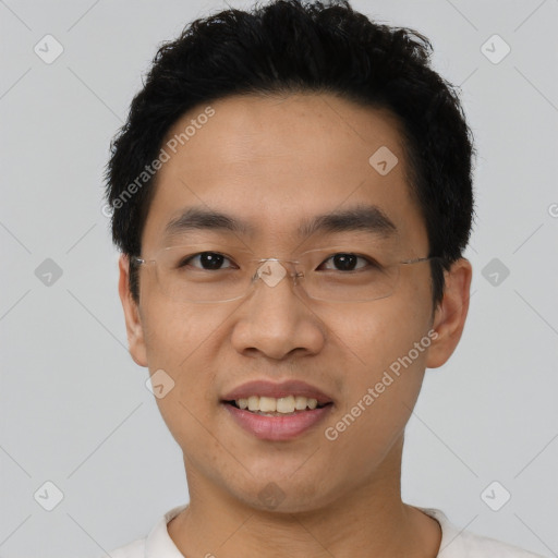 Joyful asian young-adult male with short  black hair and brown eyes