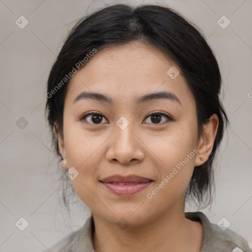 Joyful asian young-adult female with medium  black hair and brown eyes