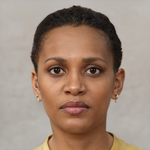 Neutral black young-adult female with short  brown hair and brown eyes