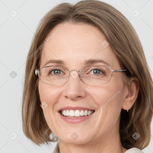 Joyful white adult female with medium  brown hair and blue eyes