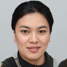 Joyful asian young-adult female with short  black hair and brown eyes