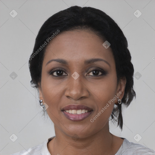 Joyful black young-adult female with medium  black hair and brown eyes