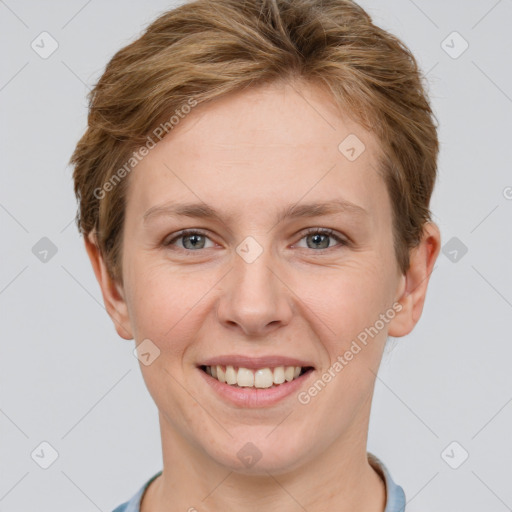 Joyful white young-adult female with short  brown hair and grey eyes