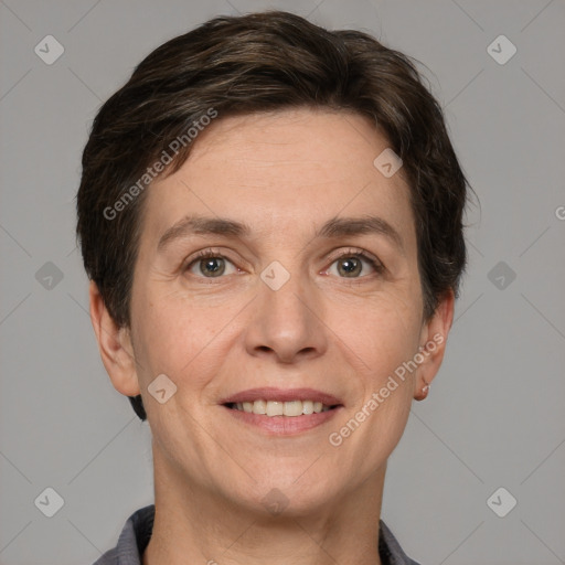 Joyful white adult female with short  brown hair and grey eyes