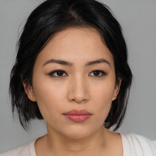 Neutral latino young-adult female with medium  brown hair and brown eyes