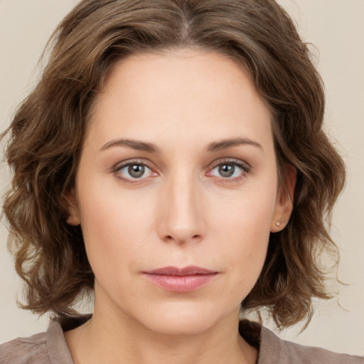 Neutral white young-adult female with medium  brown hair and green eyes