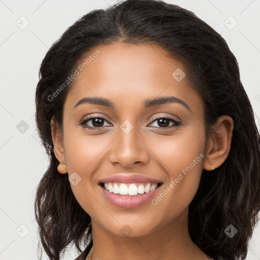 Joyful latino young-adult female with long  brown hair and brown eyes