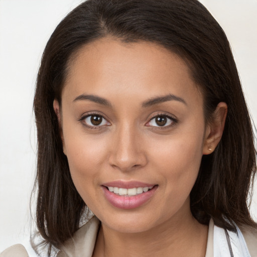 Joyful white young-adult female with medium  brown hair and brown eyes