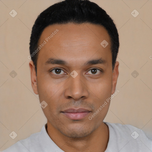 Joyful latino young-adult male with short  black hair and brown eyes