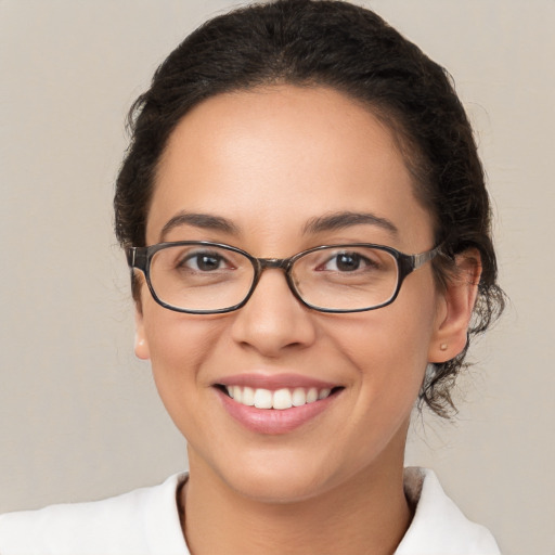 Joyful white young-adult female with medium  brown hair and brown eyes