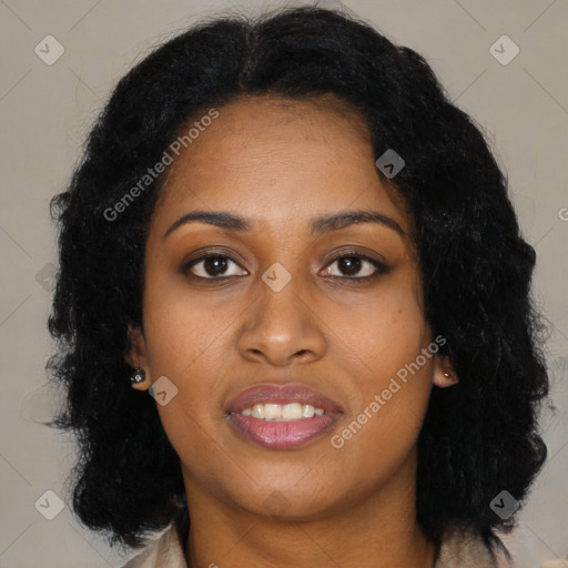 Joyful black young-adult female with long  black hair and brown eyes