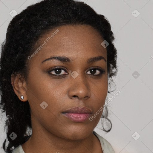 Neutral black young-adult female with medium  brown hair and brown eyes