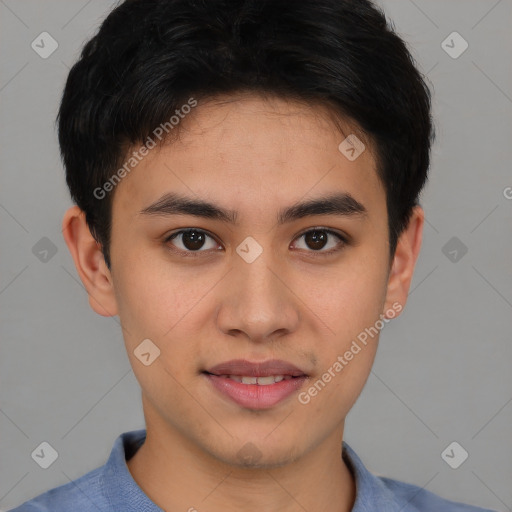 Joyful asian young-adult male with short  brown hair and brown eyes