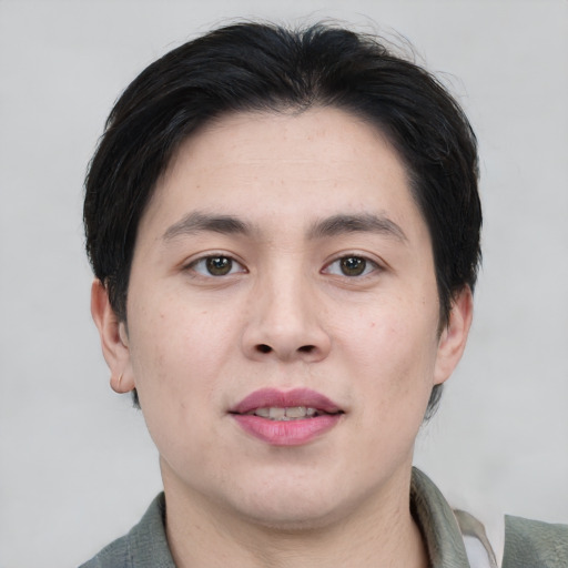 Joyful white young-adult male with short  black hair and brown eyes
