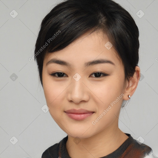 Joyful asian young-adult female with medium  black hair and brown eyes