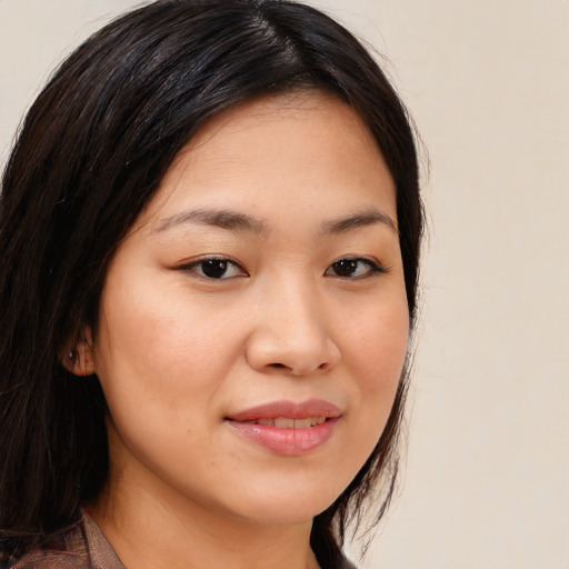 Joyful white young-adult female with medium  brown hair and brown eyes