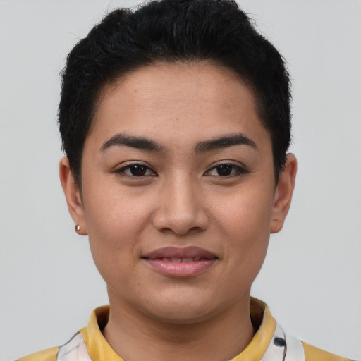 Joyful latino young-adult female with short  brown hair and brown eyes