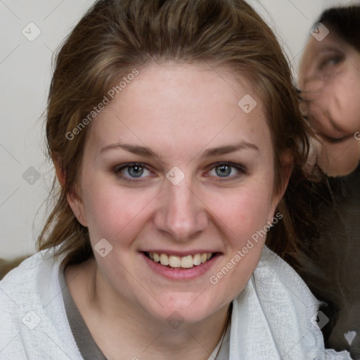 Joyful white young-adult female with medium  brown hair and blue eyes