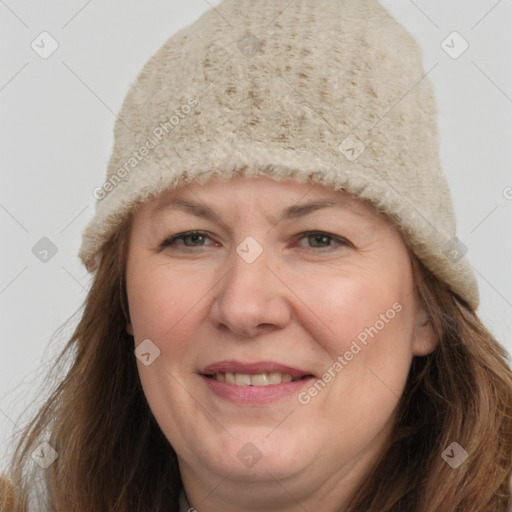 Joyful white adult female with long  brown hair and brown eyes