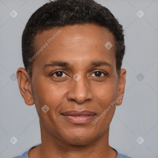 Joyful black young-adult male with short  brown hair and brown eyes