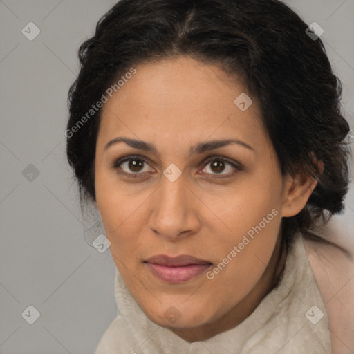 Joyful latino adult female with medium  brown hair and brown eyes