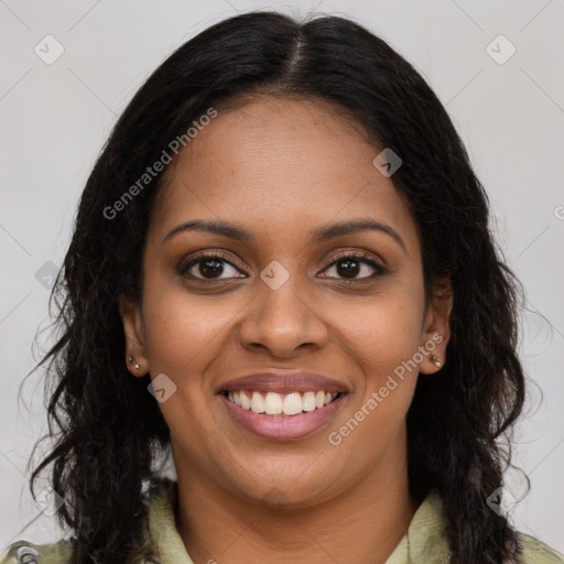 Joyful black young-adult female with long  brown hair and brown eyes