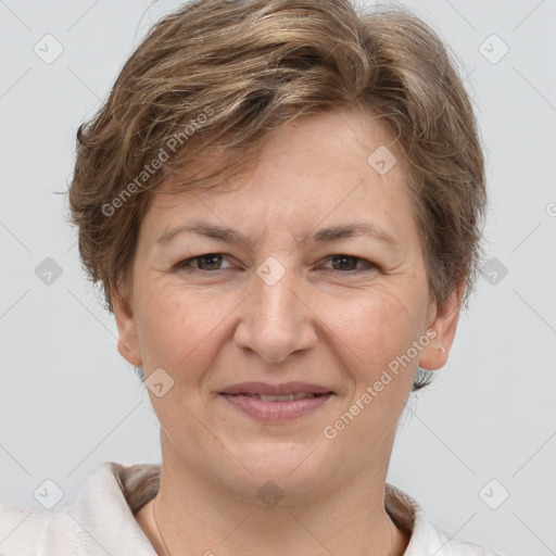 Joyful white adult female with short  brown hair and grey eyes