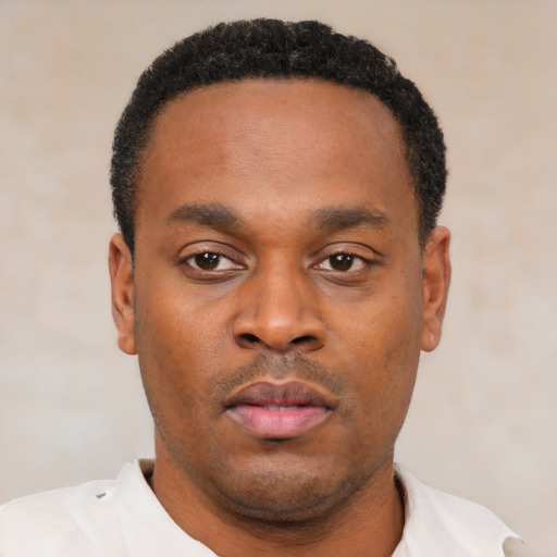 Neutral black young-adult male with short  black hair and brown eyes