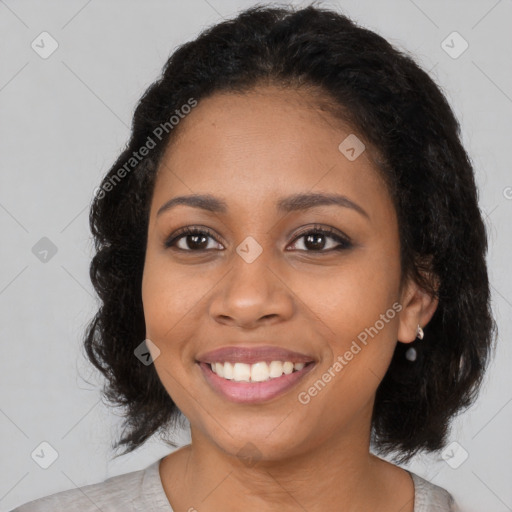 Joyful black young-adult female with medium  brown hair and brown eyes